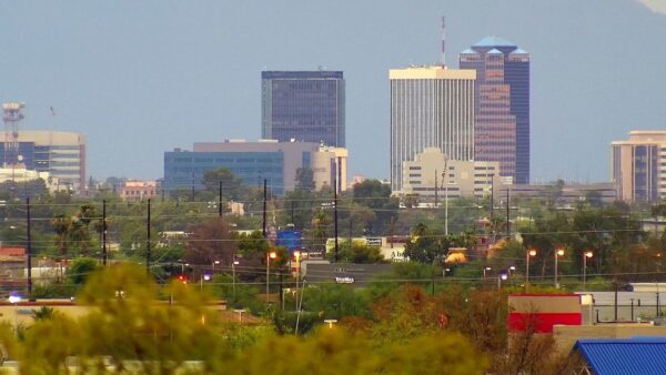 Photo of downtown Tucson with tall buildings and trees